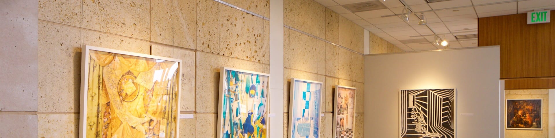 An art gallery with various paintings on display.