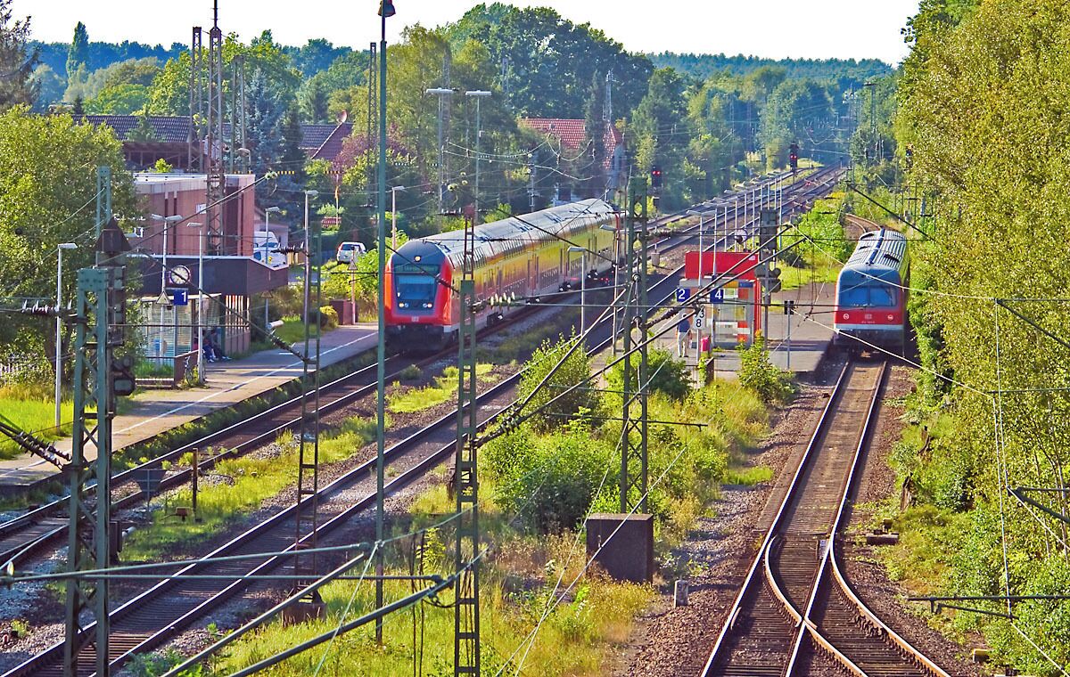 A railway station with multiple tracks and trains.
