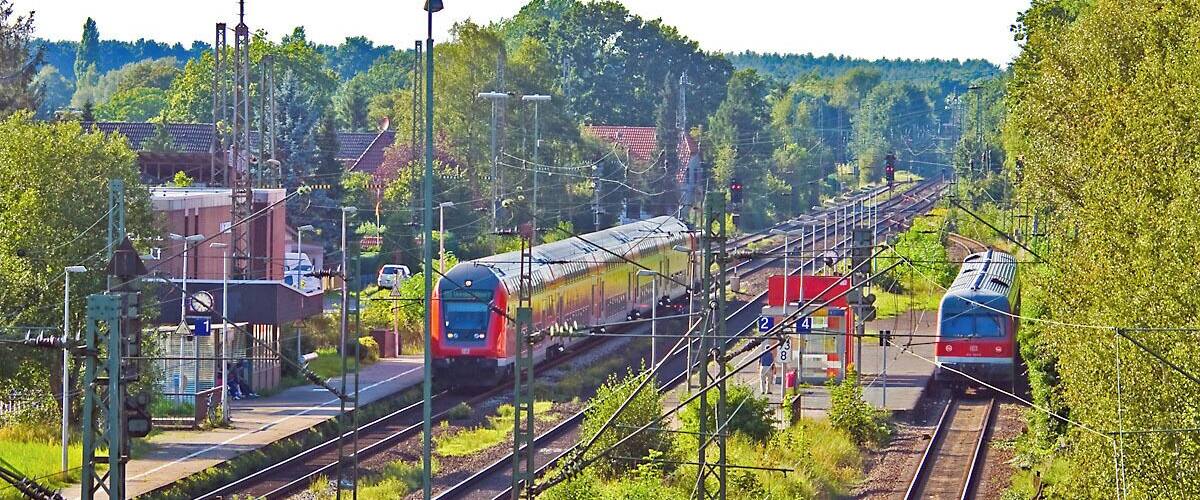 A railway station with multiple tracks and trains.