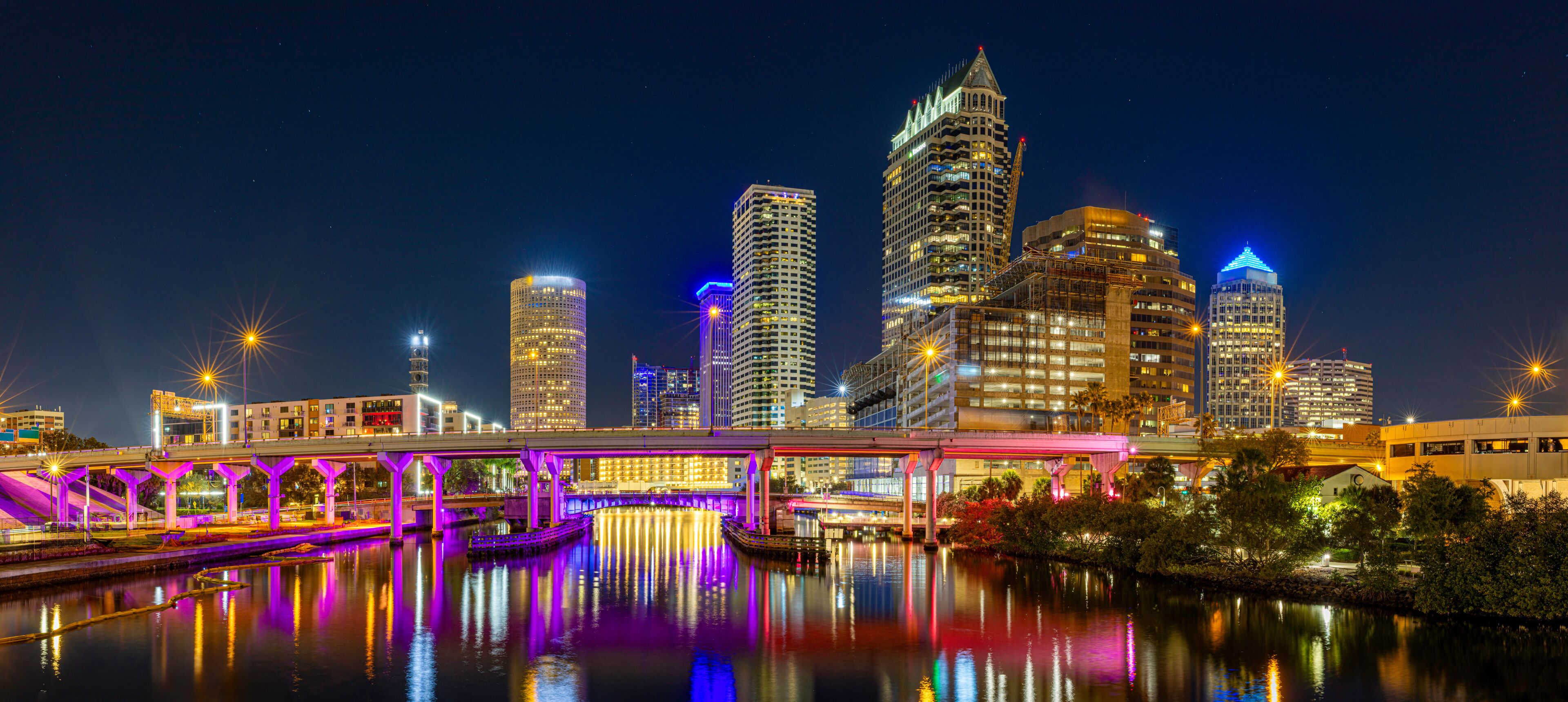 Tampa Downtown Skyline at Night with Bright Reflections on Hillsborough River