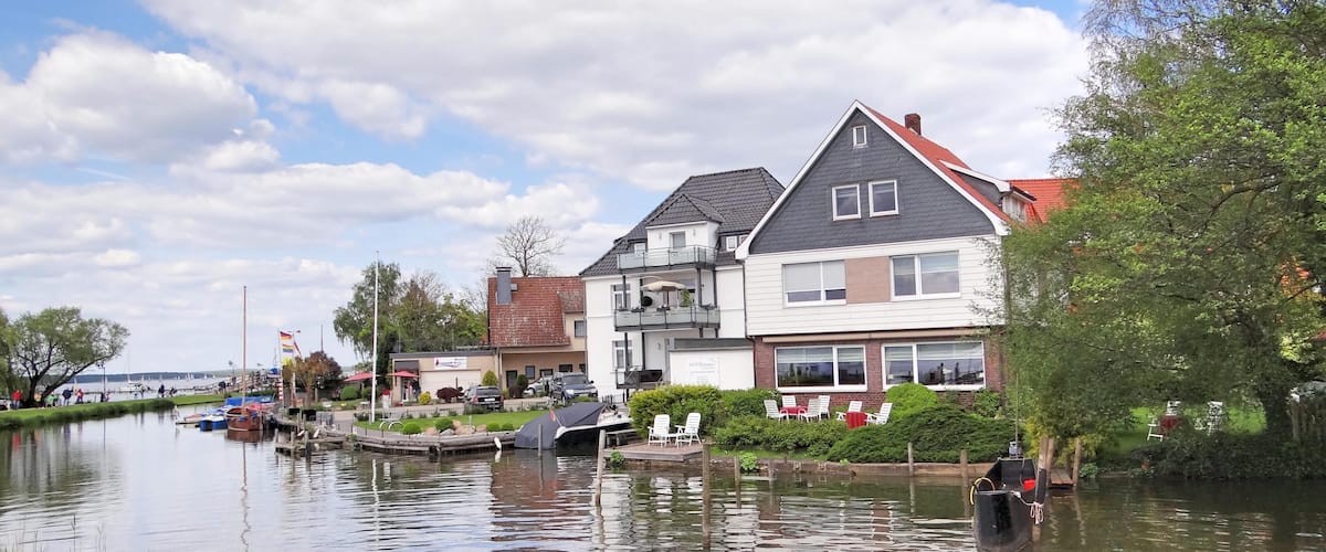 A canal with houses and boats.