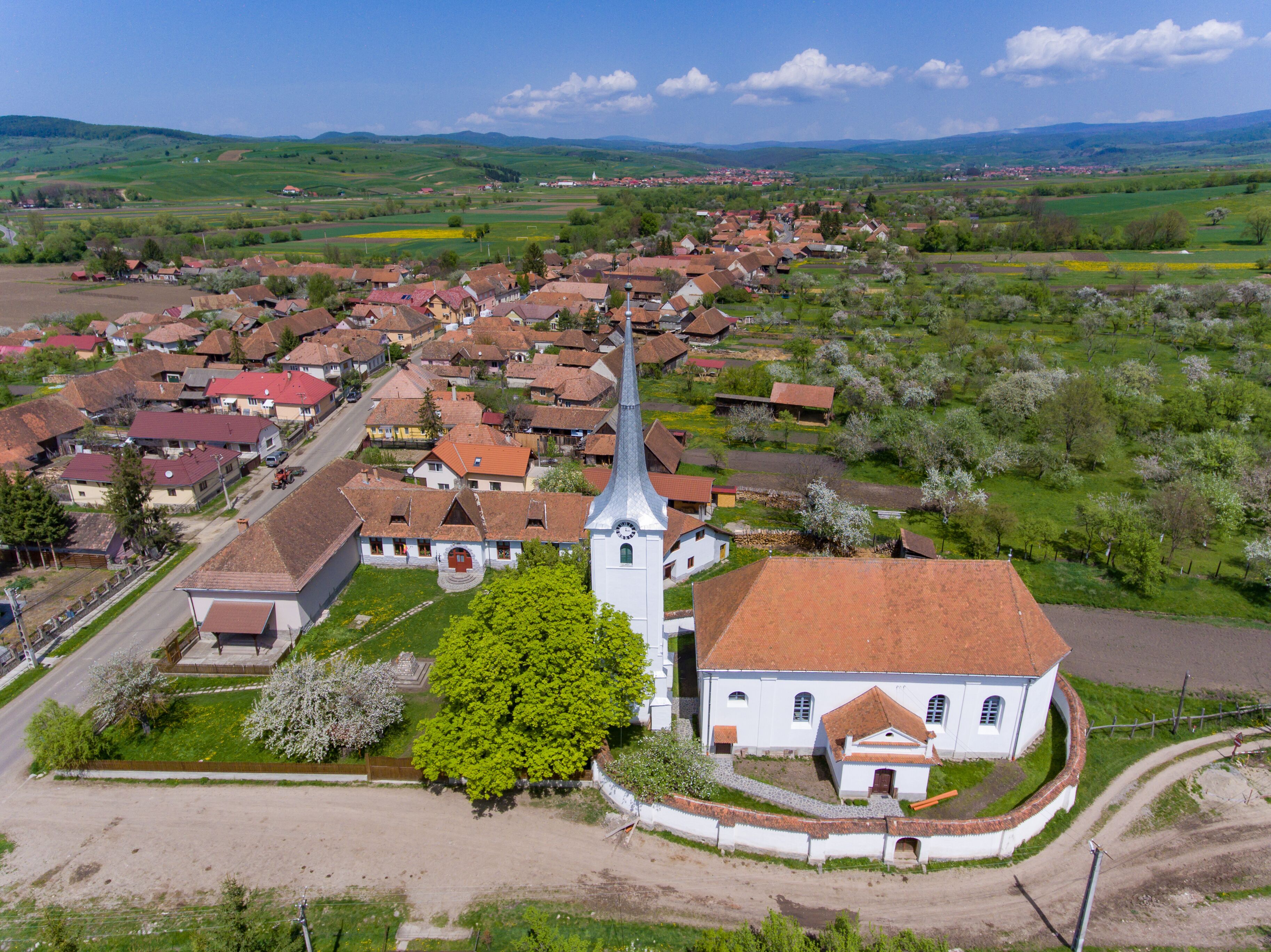 Talisoara Olasztelek  village Church in Covasna County, Transylvania, Romania aerial view