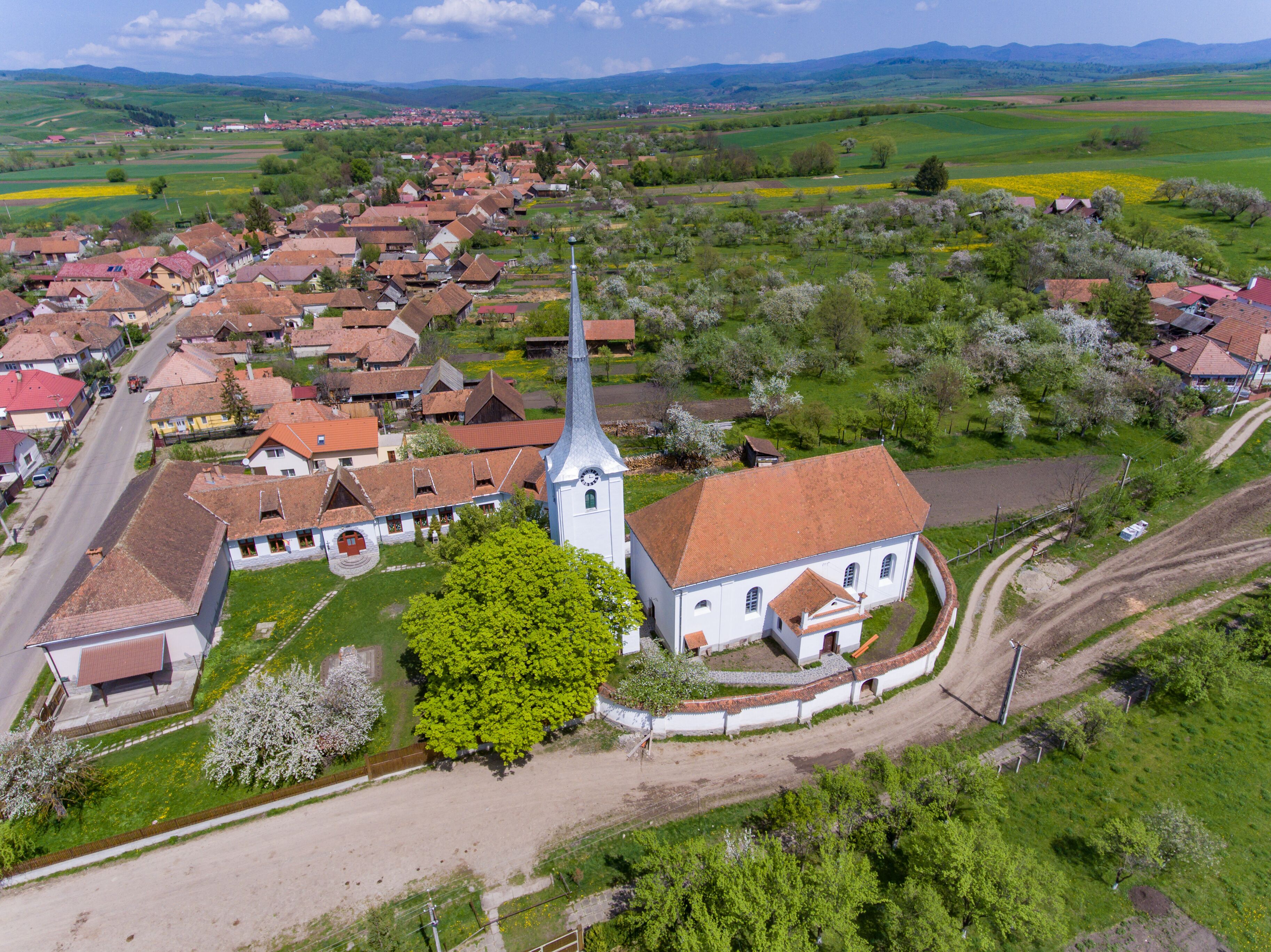 Talisoara Olasztelek  village Church in Covasna County, Transylvania, Romania aerial view