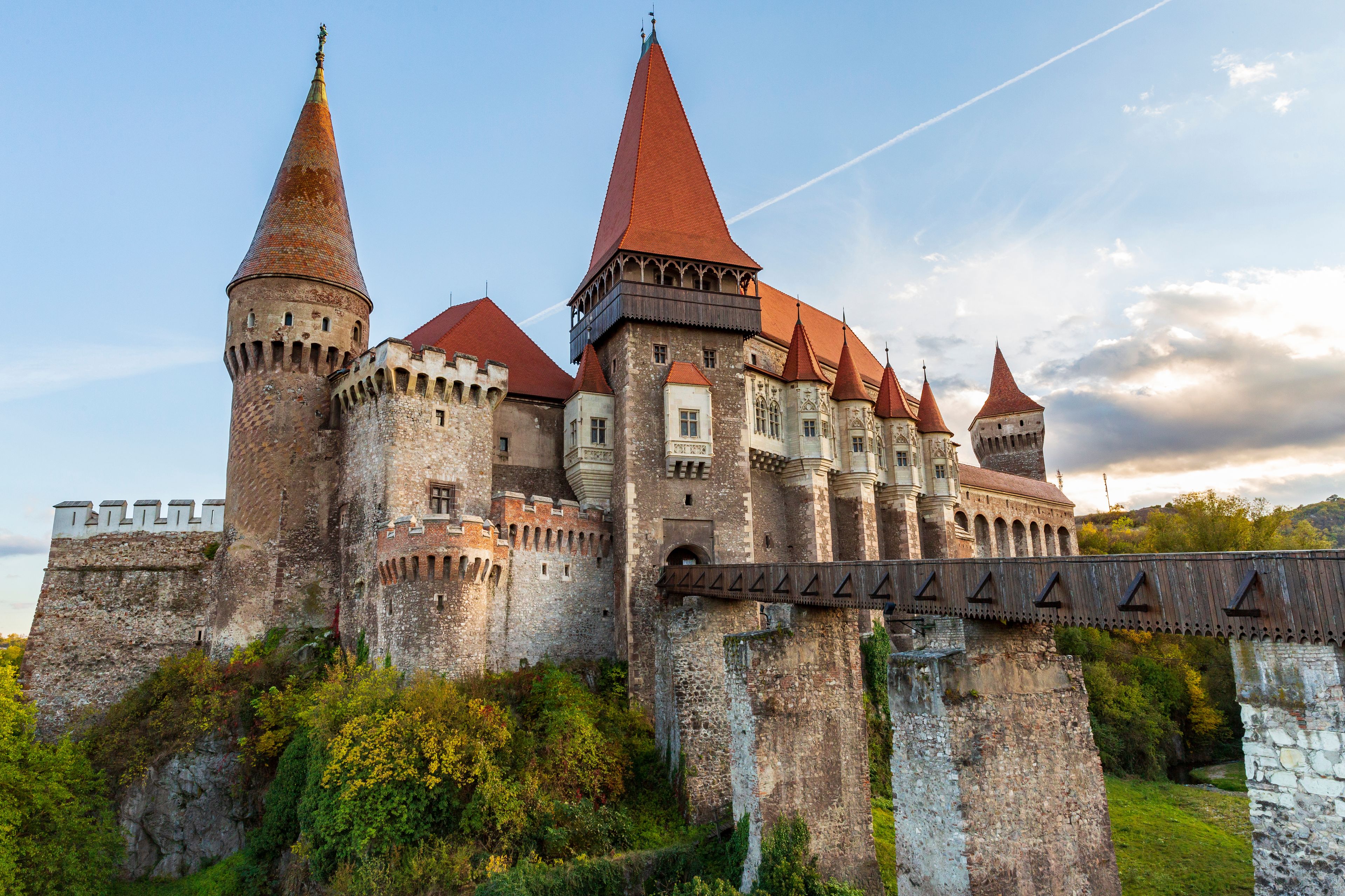A historic castle with multiple towers and a bridge.