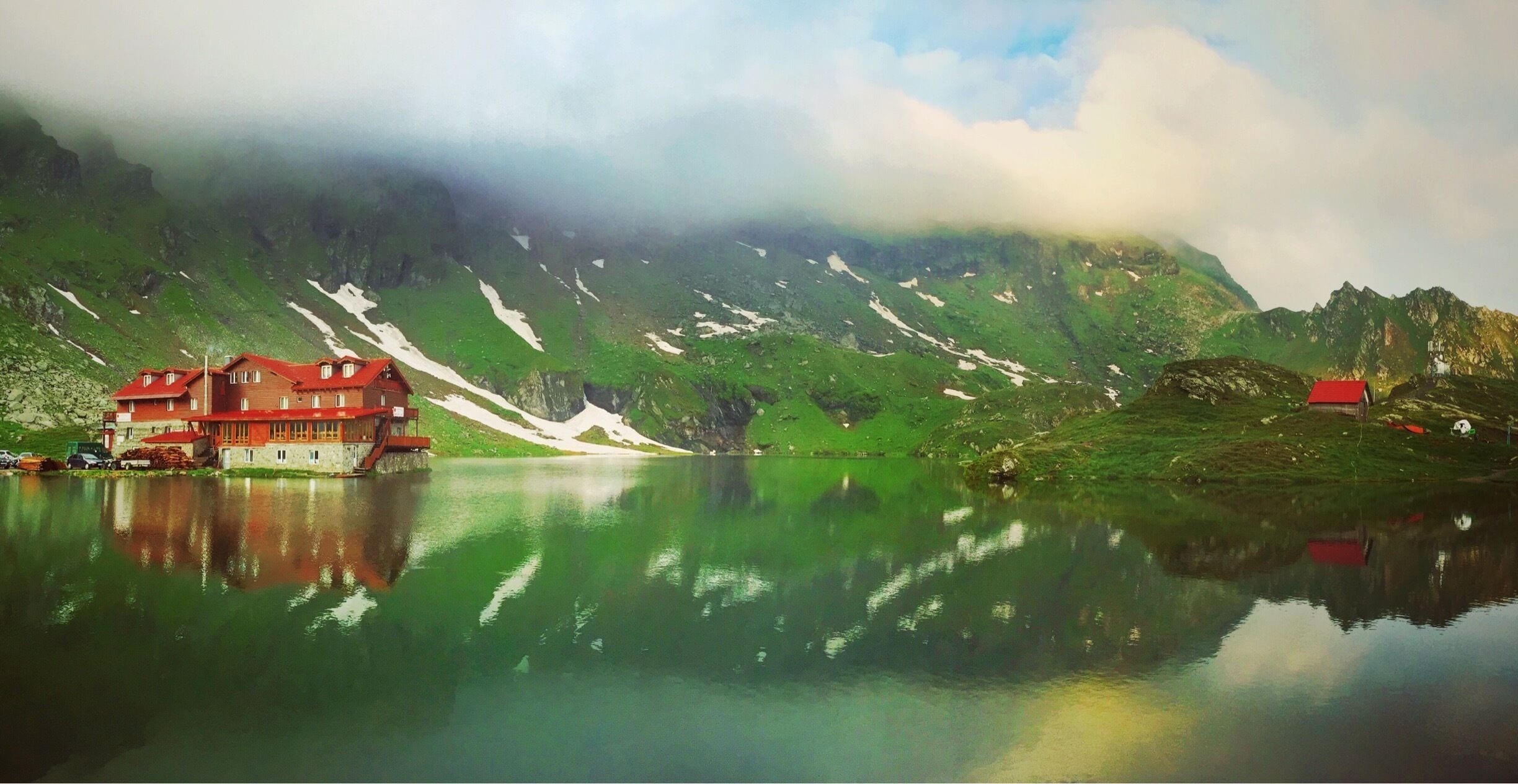 After hiking for a few hours on what turned out to be the wrong path, we finally made our way back to the car to drive up the awesome Transfagarasan Road (only like the coolest road I've ever travelled). When we arrived at the lake it was already pretty late so we decided to stay the night in the cabin, and the day after we got up at 4 AM to watch the sun rise over the misty mountains. One of the highlights on our trip to Romania for sure! #europe #romania #balealac #transfagarasanroad #carpathianmountains #green
