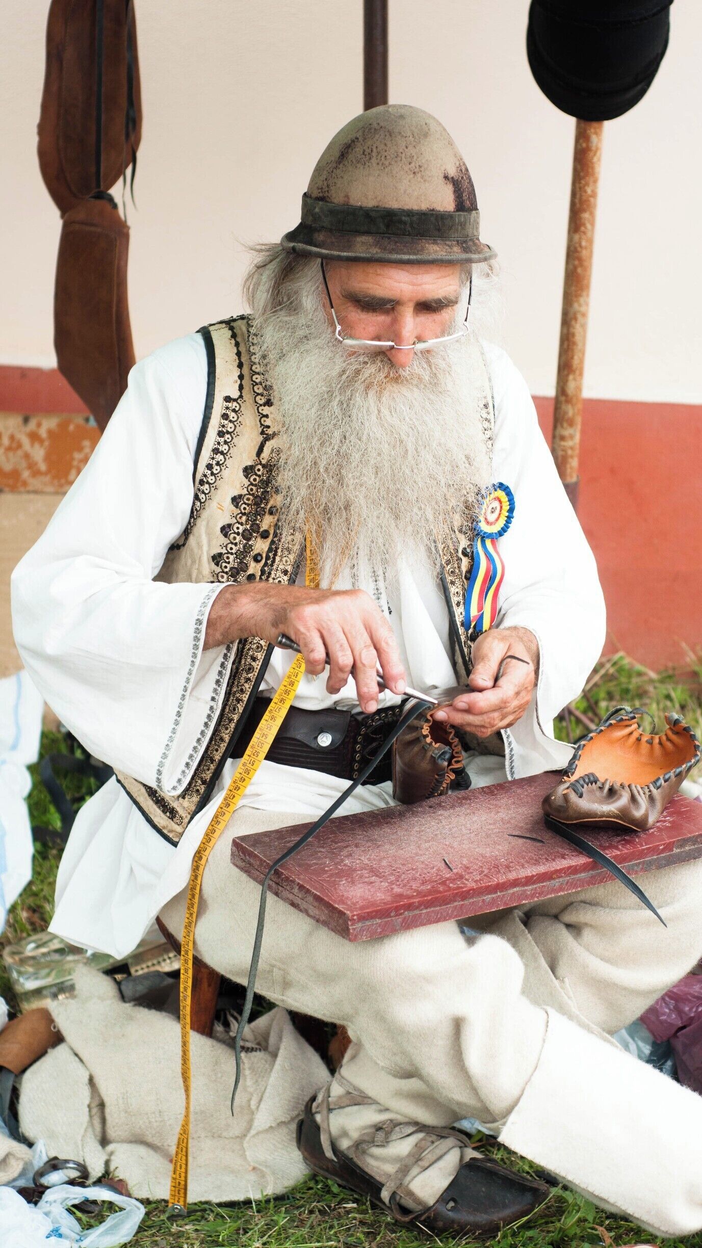 Traditional craftsmen making peasant's sandals