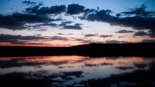 Sun setting over lake in eNtokozweni South Africa