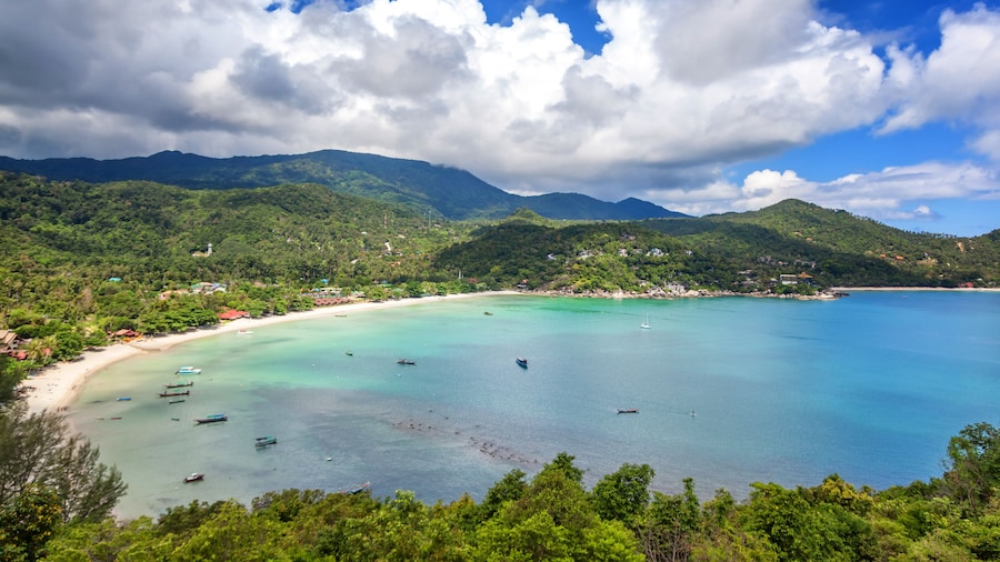 Beautiful tropical beach with blue water and green hills, top view. Koh Phangan, Thailand, Ao Thong Nai Pan Noi