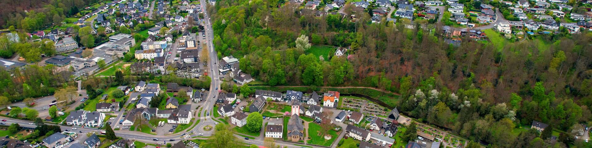 Aerial view around the old town of the city Odenthal, Germany on a sunny spring morning