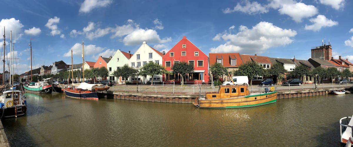 A harbor with colorful buildings and boats.
