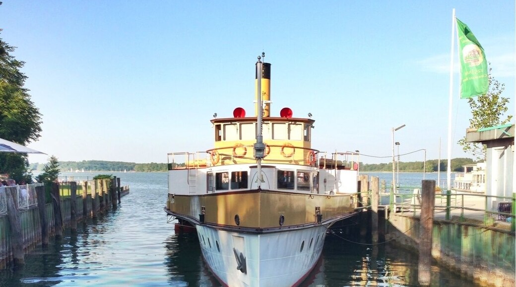 A number of boats ferry tourists to, from and between the islands on Chiemsee and the towns round the lakeside. One of these is the 1920s paddle steamer, Ludwig Fessler.