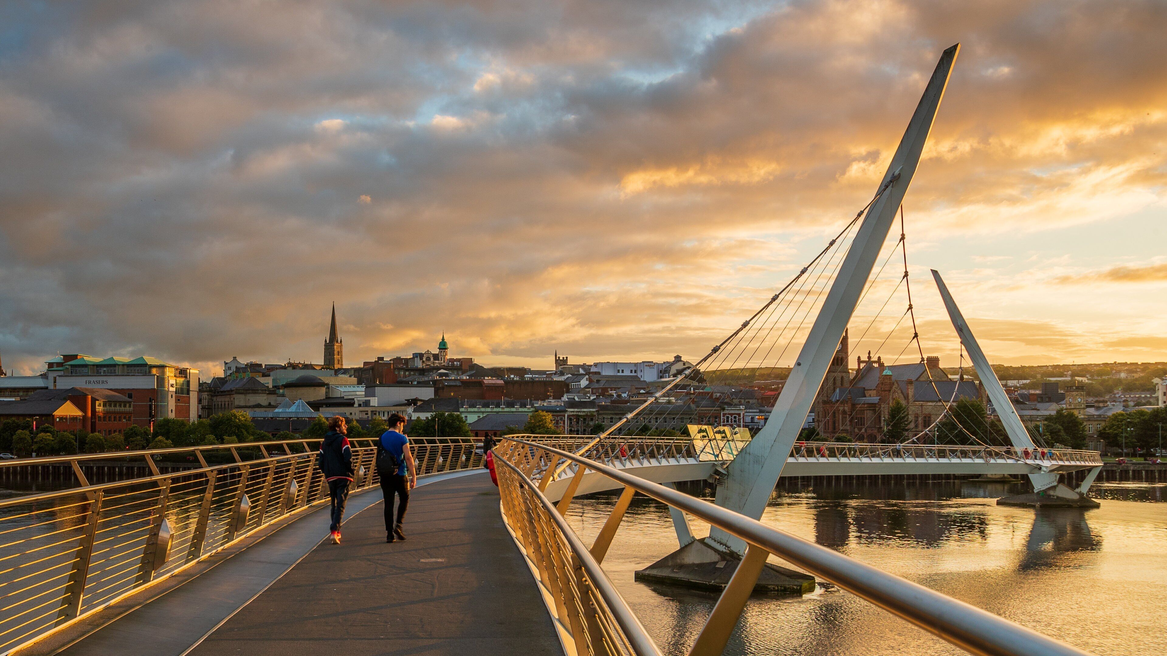 Peace Bridge featuring a river or creek, a bridge and a sunset