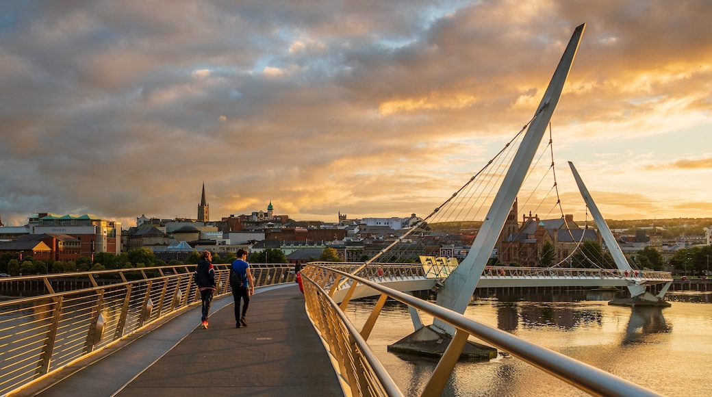 Peace Bridge featuring a river or creek, a bridge and a sunset