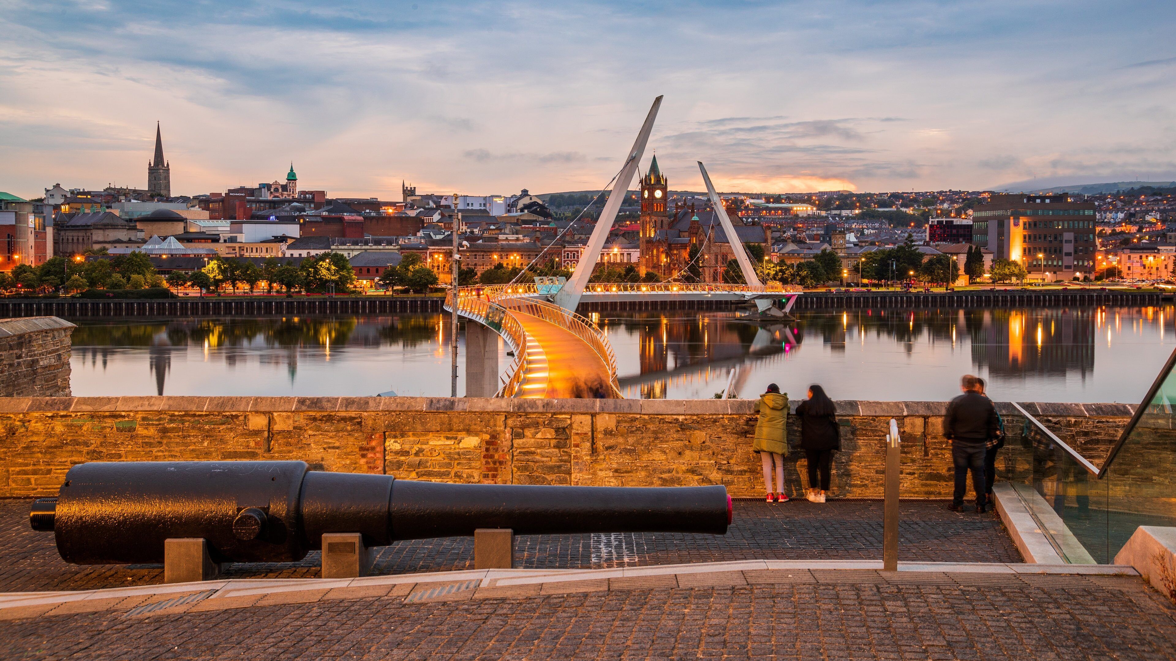 Peace Bridge showing a bridge, a river or creek and a sunset