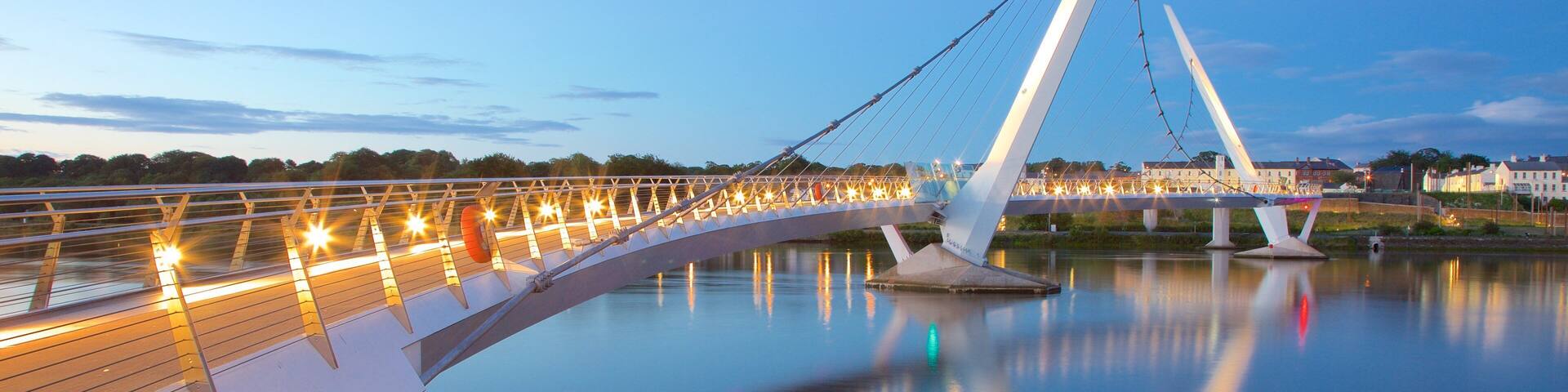 Peace Bridge featuring a city, a sunset and a river or creek