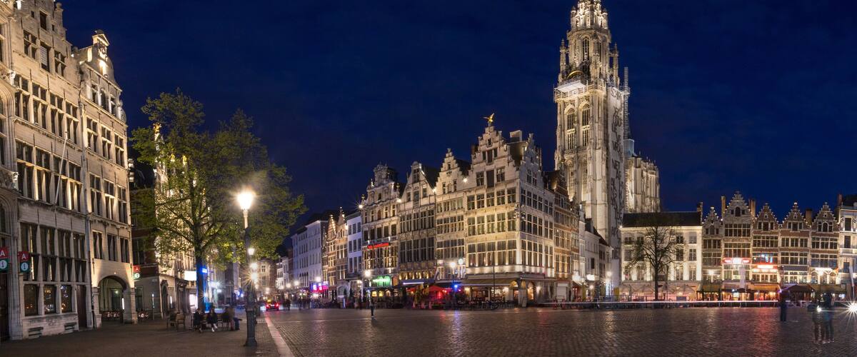 A historic square with ornate buildings and a prominent tower.