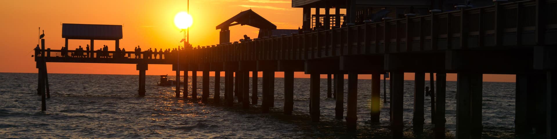 Colorful coastal sunset at the iconic Pier 60 in Clearwater Beach, Florida.