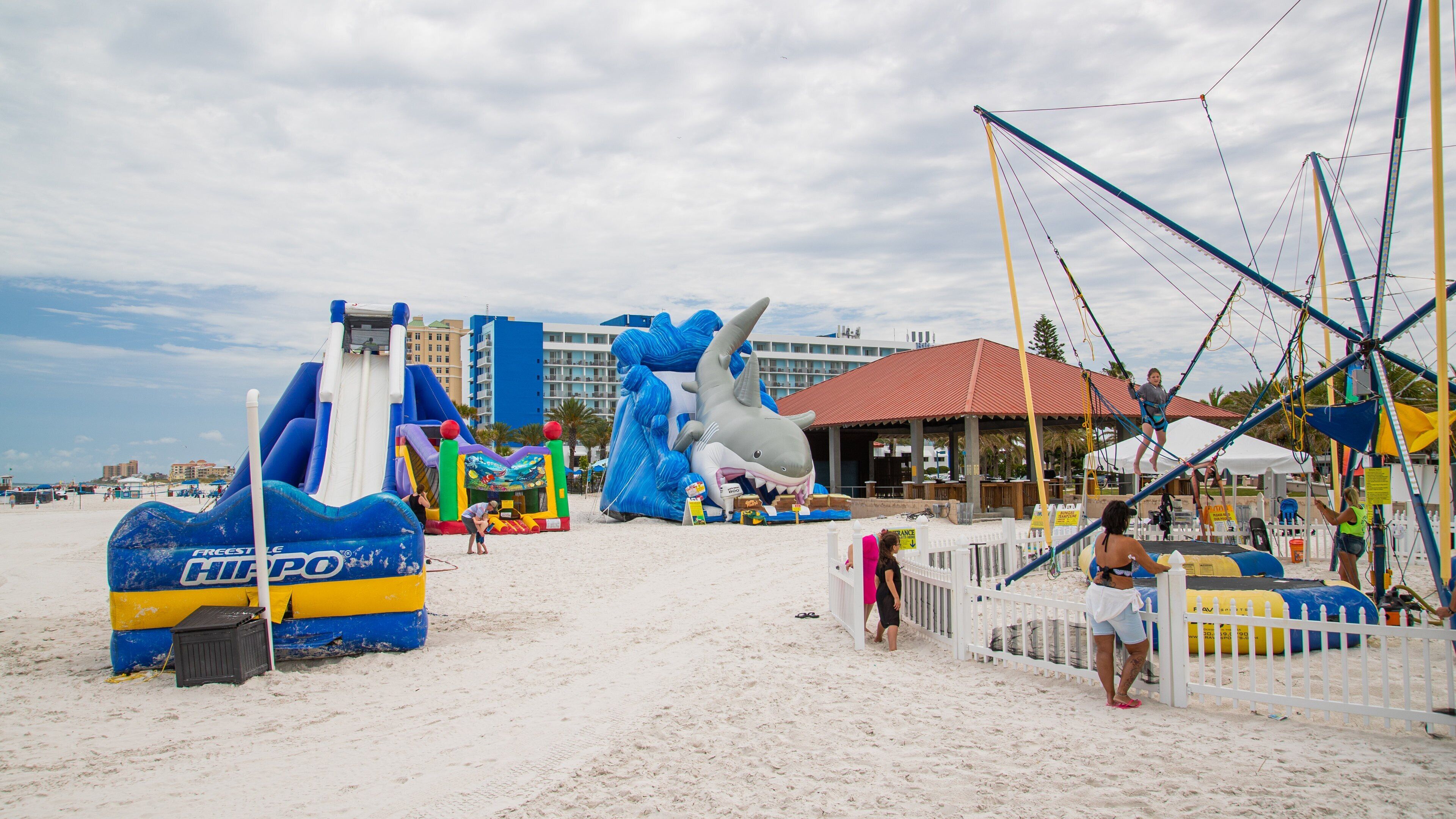 Pier 60 Park featuring a beach, general coastal views and a playground