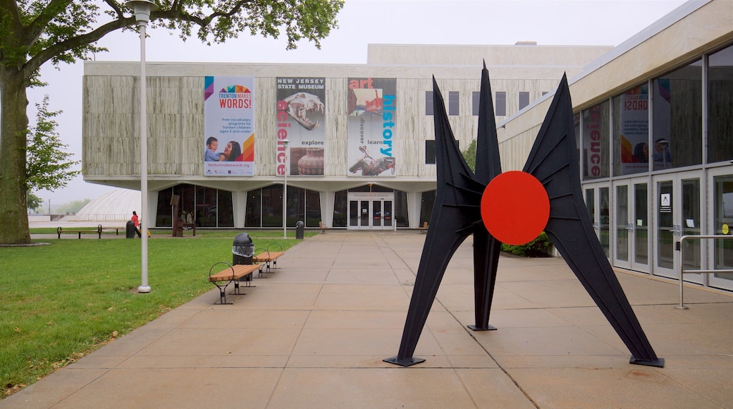 New Jersey State Museum featuring outdoor art, a park and signage