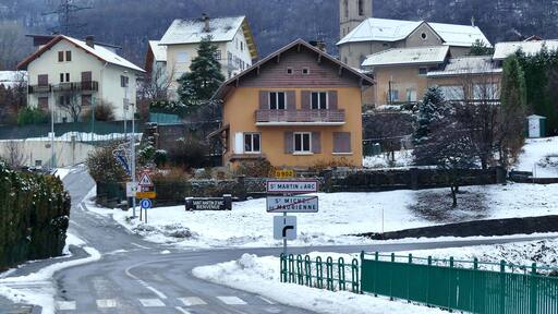 Entrance into the snow-covered village of Saint-Martin-d'Arc in Savoie, France.