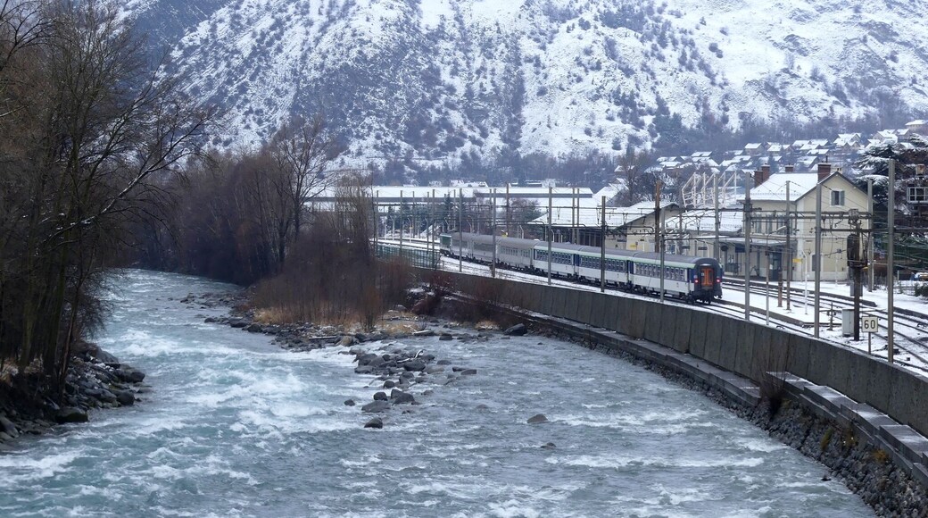 Sight of the Arc river crossing Saint-Michel-de-Maurienne in the snow-covered Maurienne valley in Savoie, France.