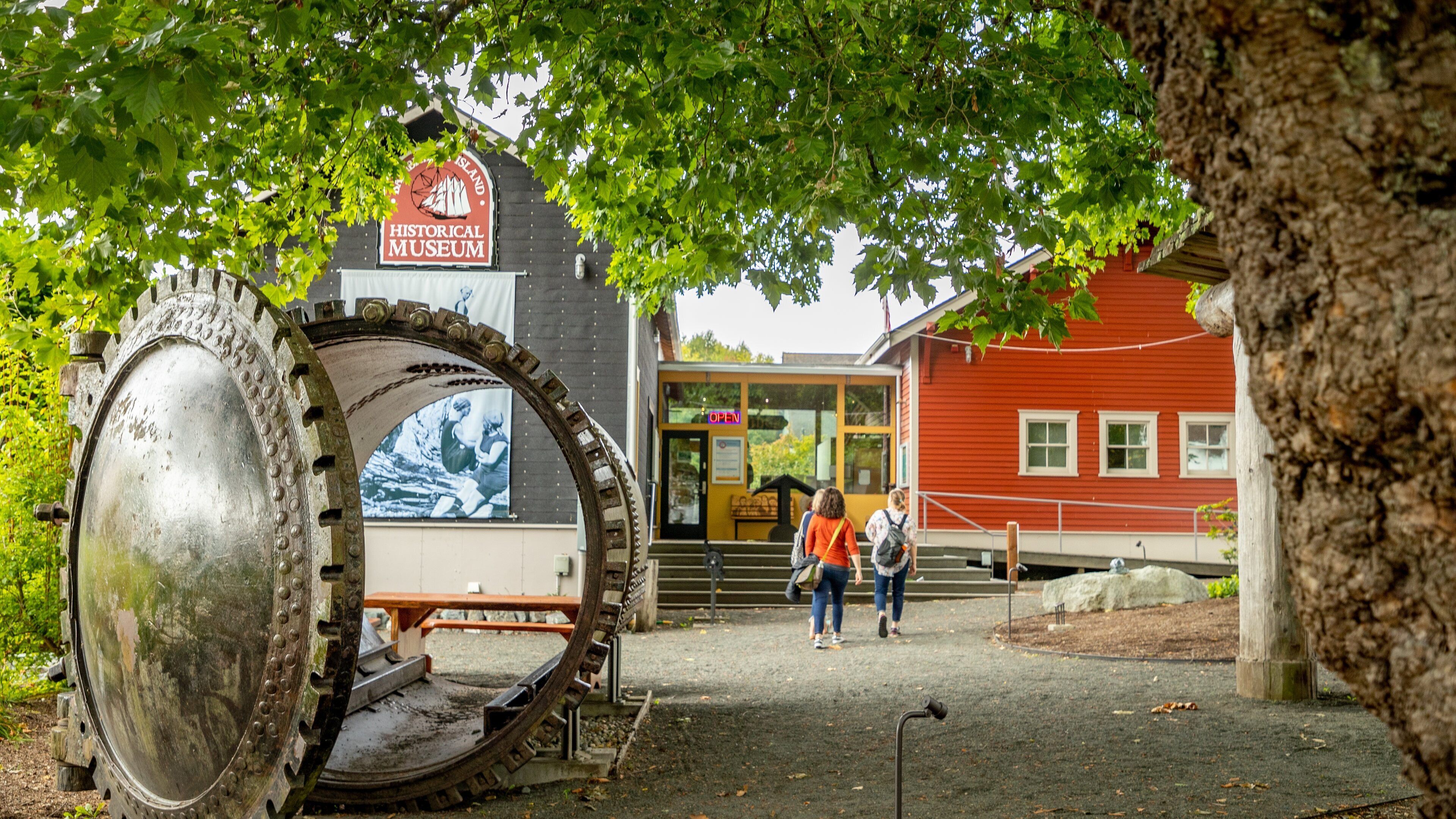 Bainbridge Island Historical Museum showing outdoor art as well as a couple