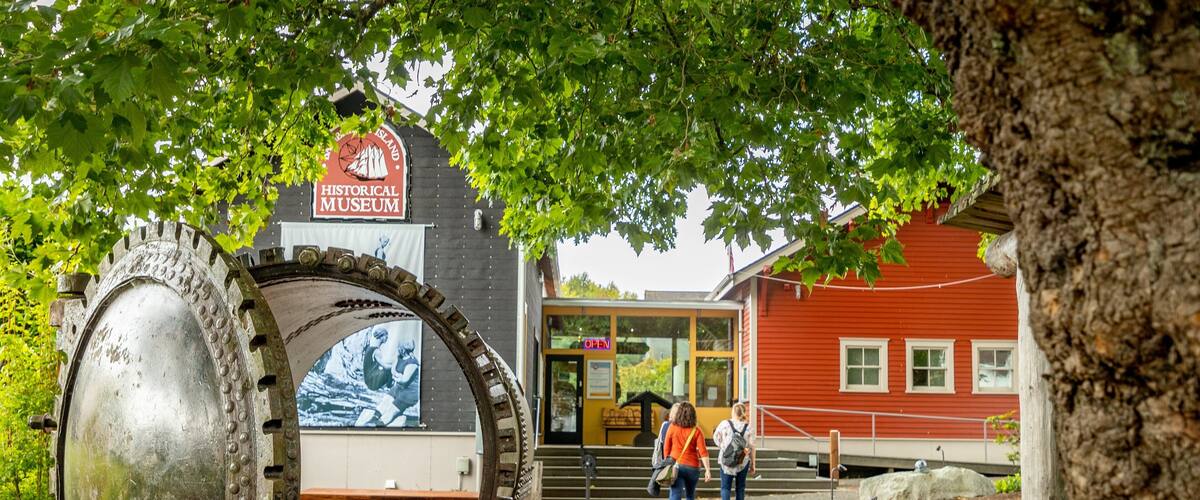 Bainbridge Island Historical Museum showing outdoor art as well as a couple