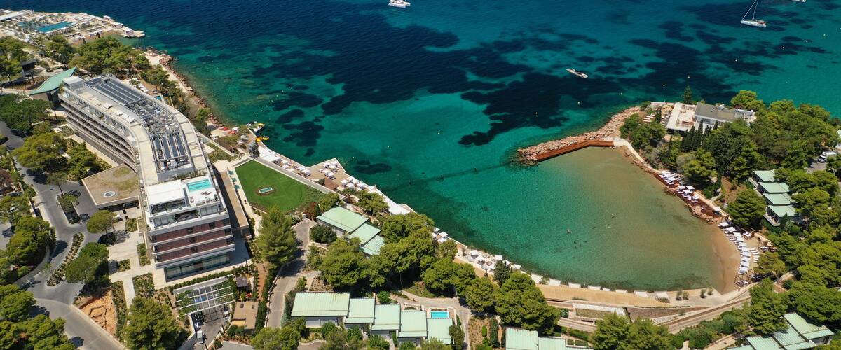 Aerial drone photo of rocky seascape in Vouliagmeni peninsula, Athens riviera, Attica, Greece