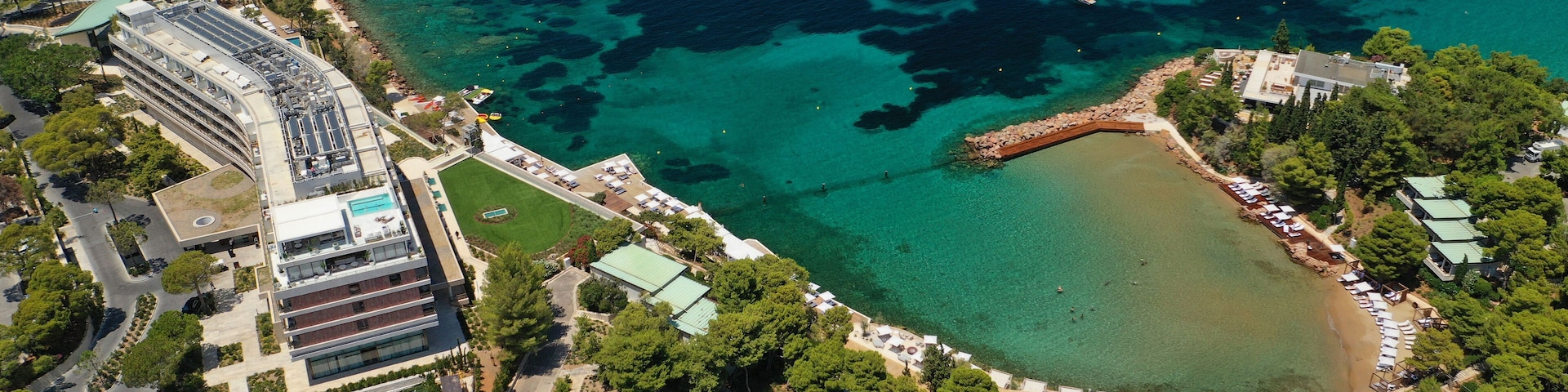 Aerial drone photo of rocky seascape in Vouliagmeni peninsula, Athens riviera, Attica, Greece