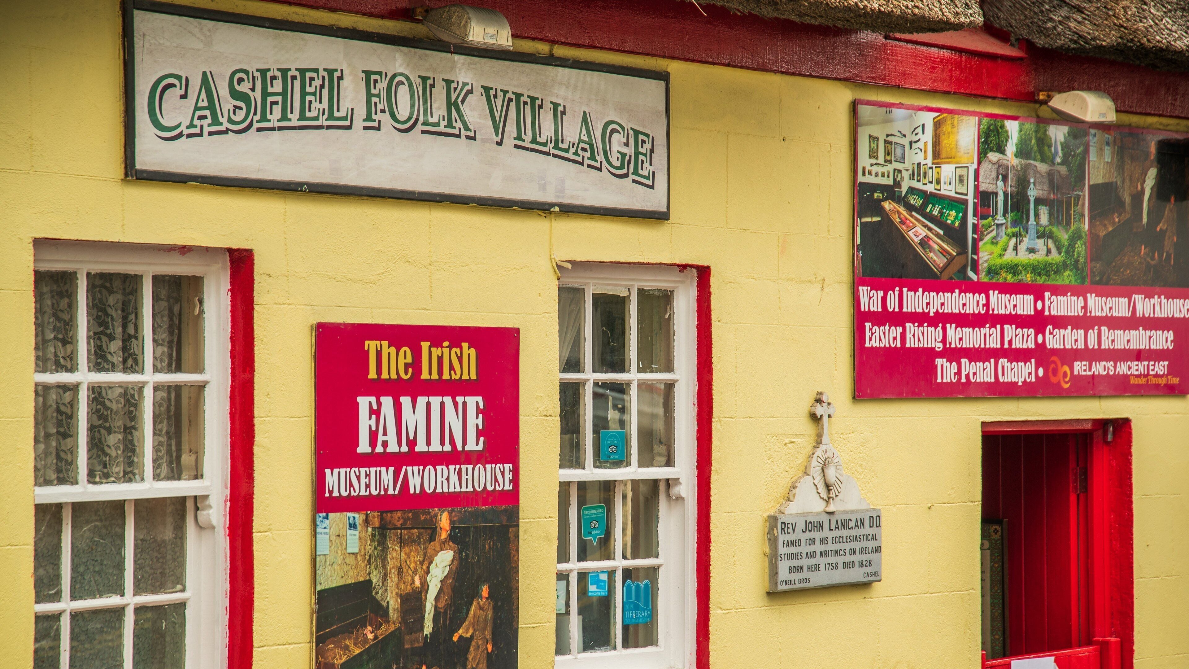 Cashel Folk Village which includes a small town or village and signage