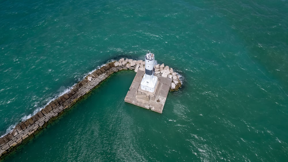 Aerial view of Conneaut lighthouse in Ohio middle of the lake Erie.