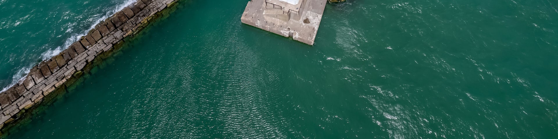Aerial view of Conneaut lighthouse in Ohio middle of the lake Erie.