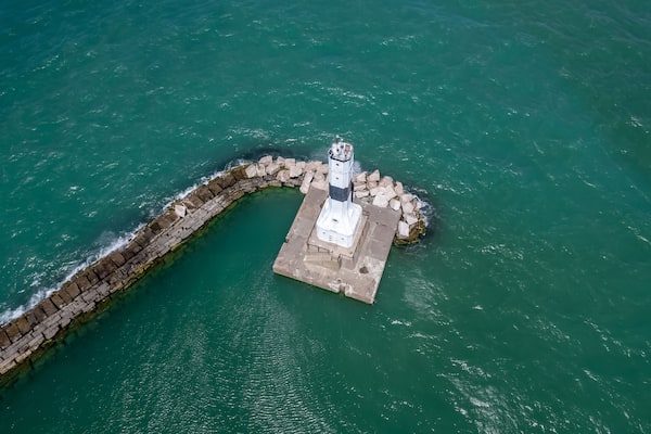 Aerial view of Conneaut lighthouse in Ohio middle of the lake Erie.