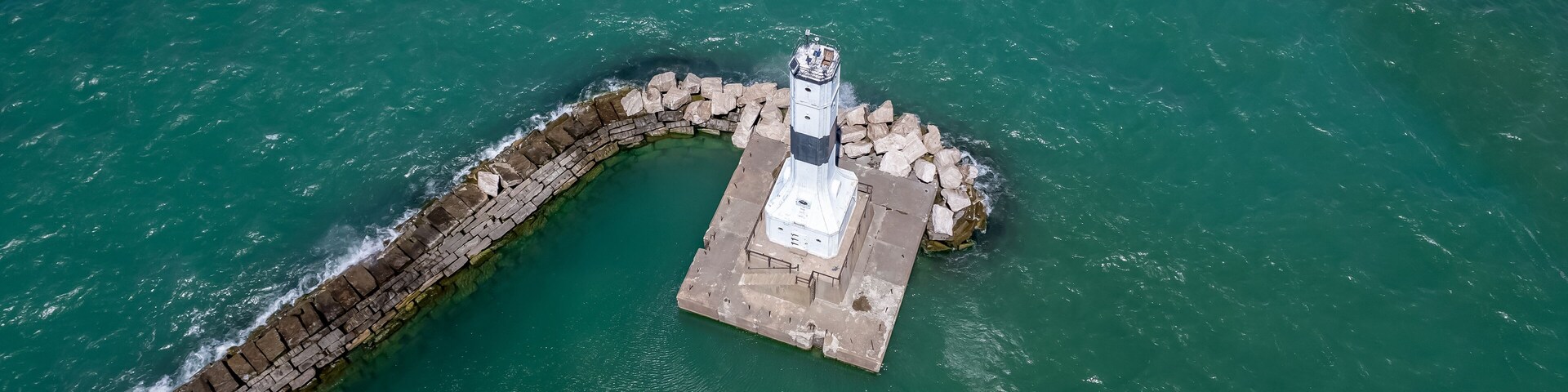 Aerial view of Conneaut lighthouse in Ohio middle of the lake Erie.
