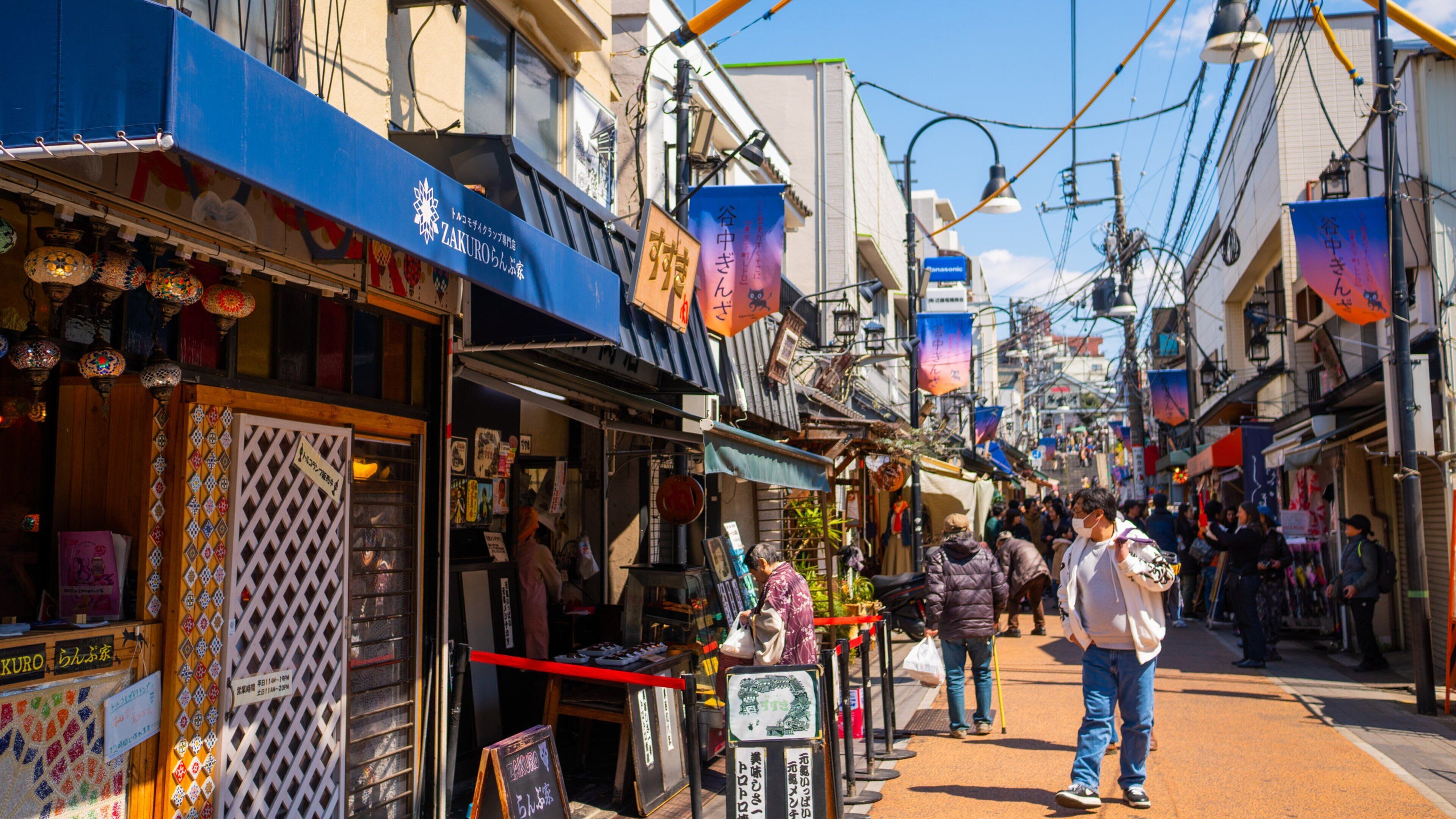 Taito showing street scenes as well as an individual male