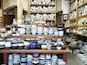 A store with shelves full of various bowls and plates.