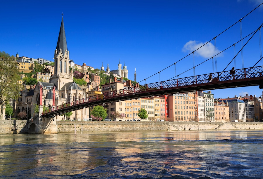 Pedestrians on the Saint Georges footbridge and the Saint Georges church in Lyon, France.; Shutterstock ID 412637899