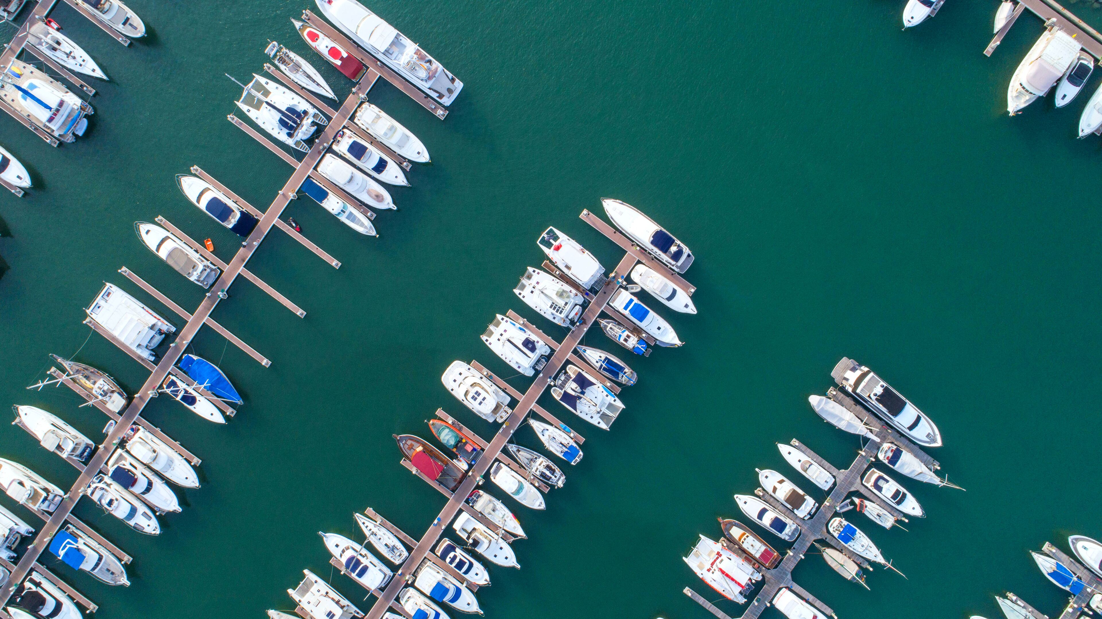Pier speedboat. A marina lot. This is usually the most popular tourist attractions on the beach.Yacht and sailboat is moored at the quay.Aerial view by drone.Top view.