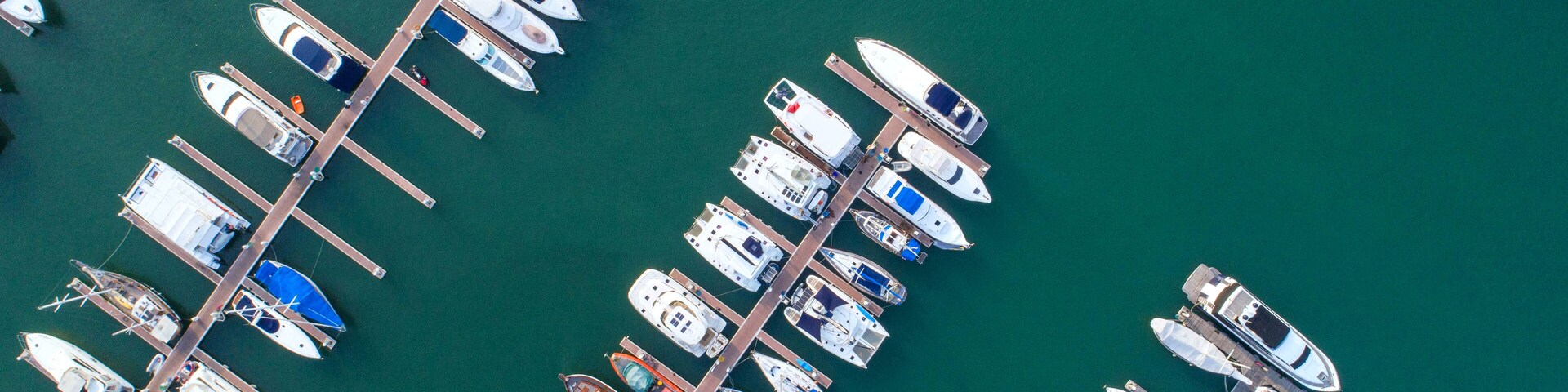 Pier speedboat. A marina lot. This is usually the most popular tourist attractions on the beach.Yacht and sailboat is moored at the quay.Aerial view by drone.Top view.