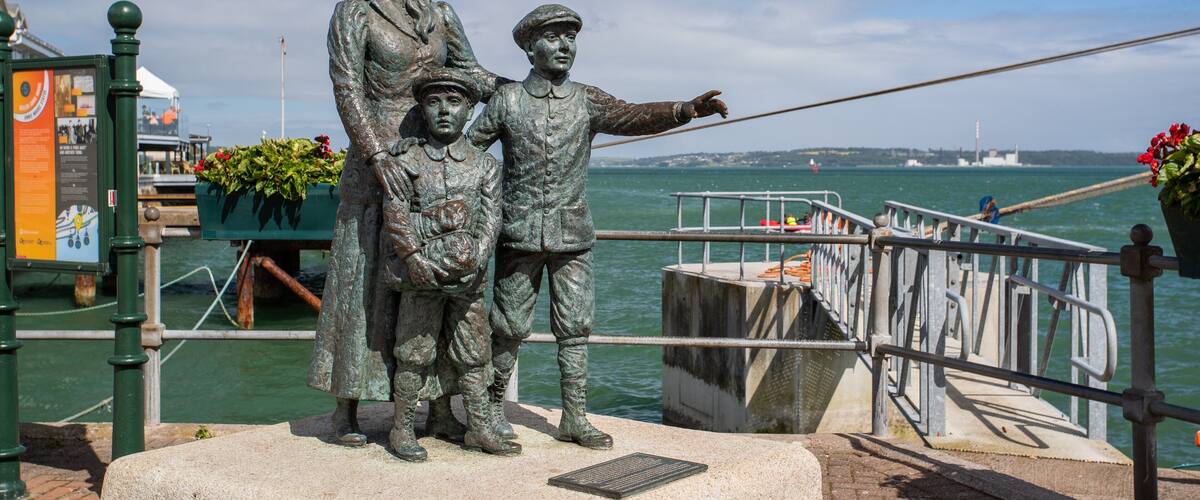 Cobh Heritage Centre showing a statue or sculpture and a bay or harbor
