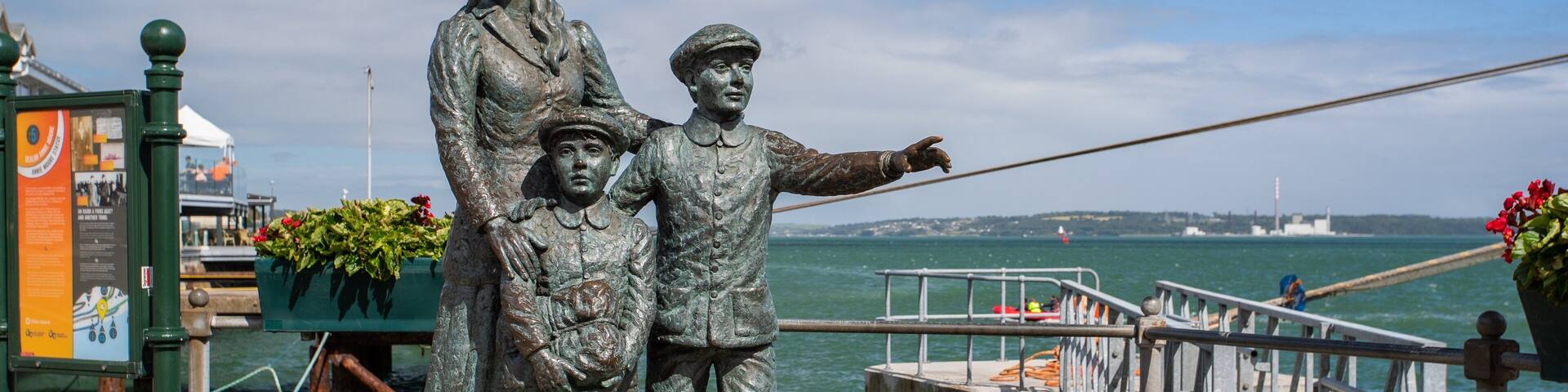 Cobh Heritage Centre showing a statue or sculpture and a bay or harbor