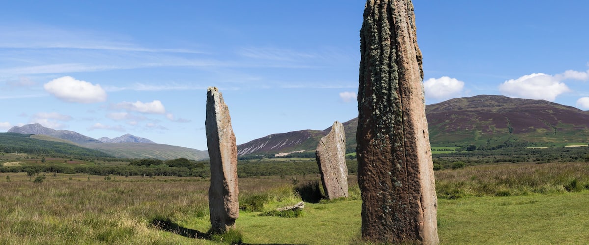 Circle 2 at Machrie Moor. In the far distance to the left are the mountains of the north of Arran, consisting of Beinn Tarsuinn and Goat Fell