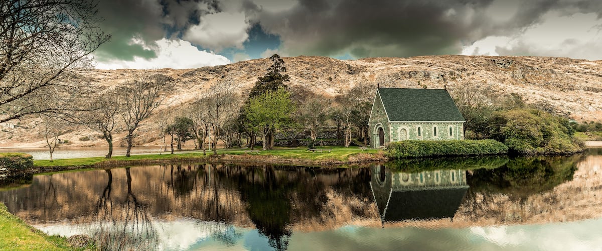View of the Gouganebarra Lake and the river Lee outside of Saint Finbarr's Oratory chapel.