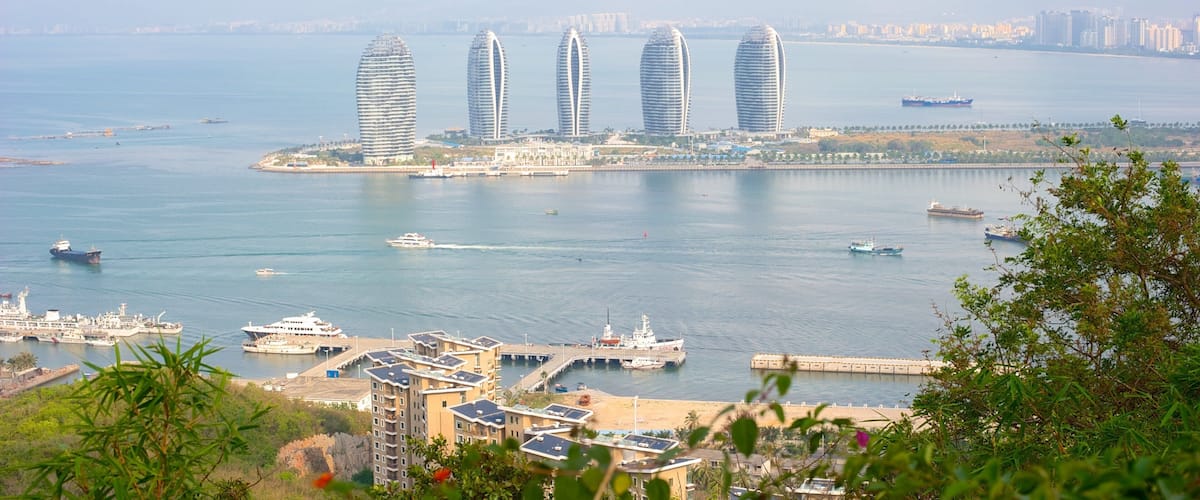 Luhuitou Park showing a bay or harbour and a high-rise building