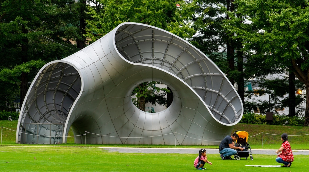 Tokyo Midtown which includes outdoor art and a garden as well as a family