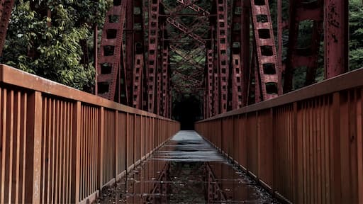 Abandoned red railway bridge. Fukuchiyama Railway