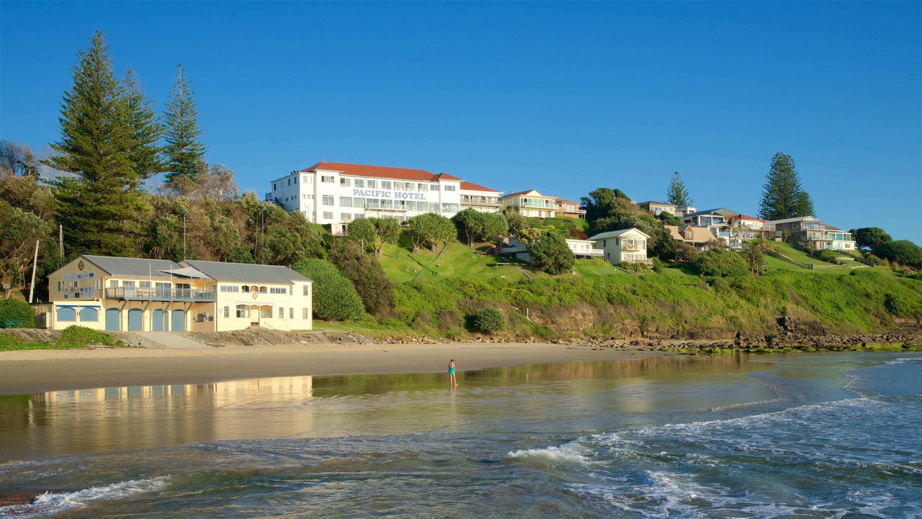 Yamba Beach featuring a sandy beach and a house