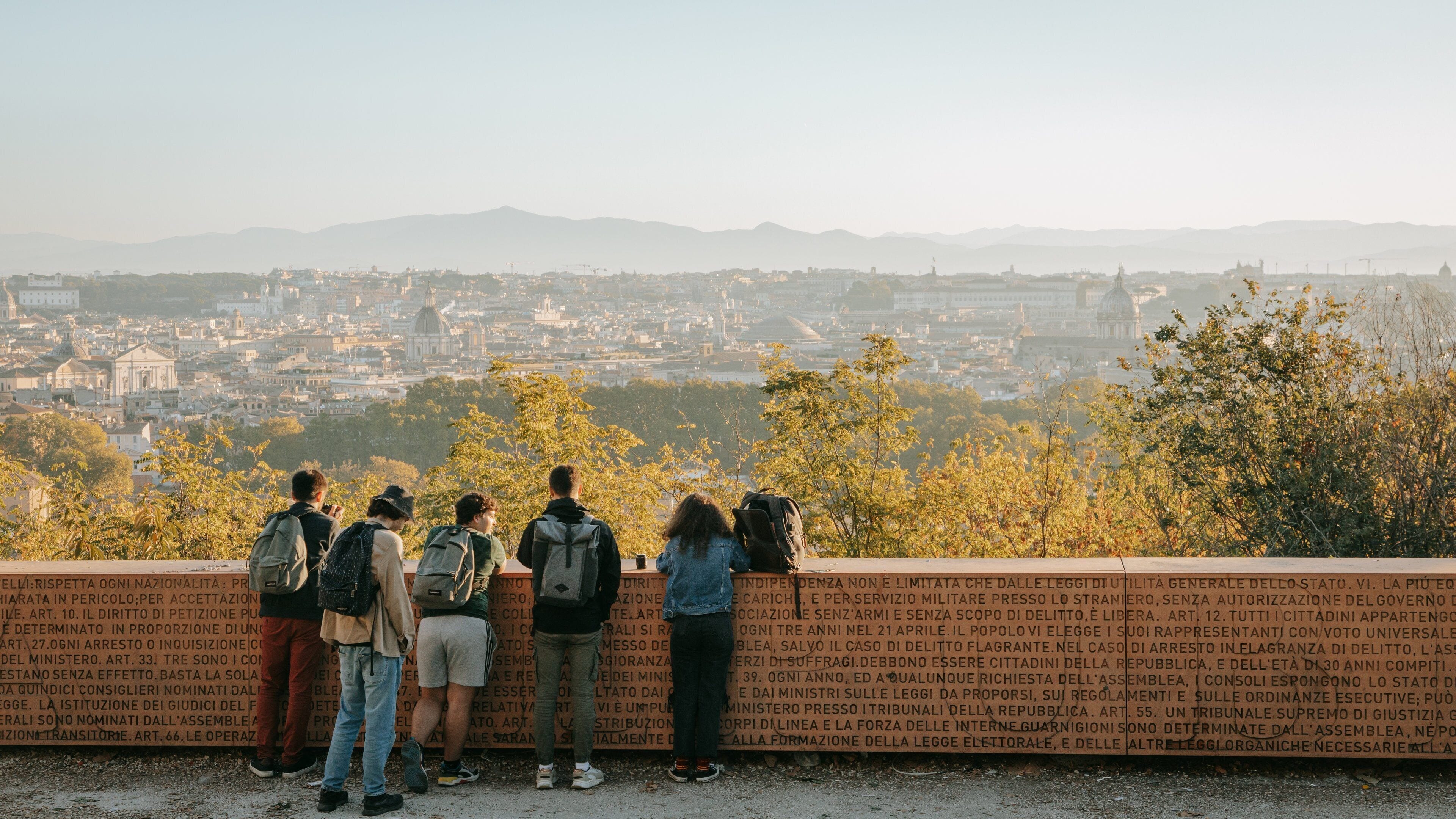 Passeggiata del Gianicolo featuring landscape views and views as well as a small group of people