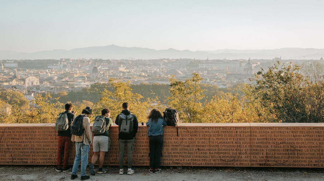Passeggiata del Gianicolo featuring landscape views and views as well as a small group of people