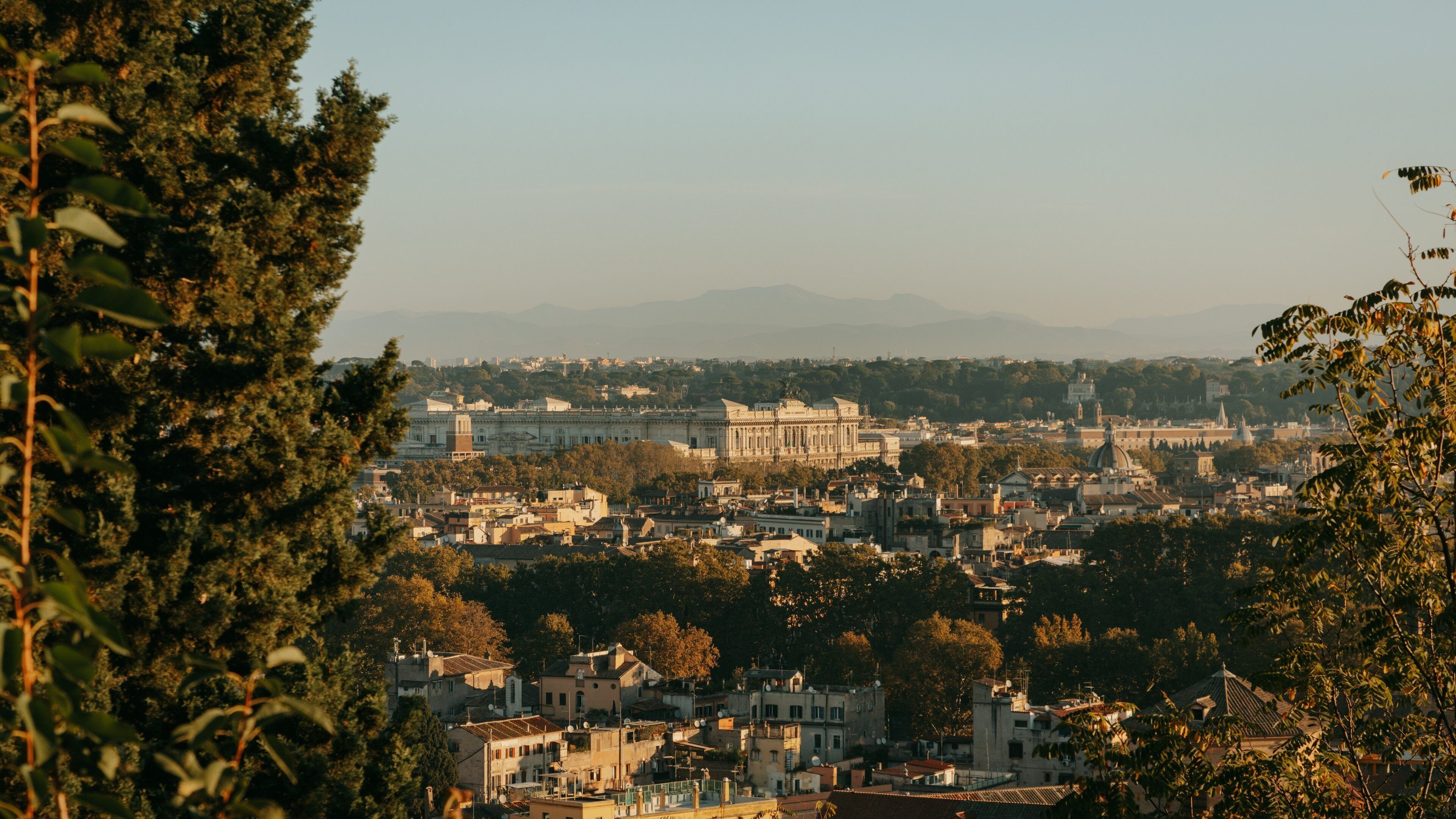Passeggiata del Gianicolo featuring landscape views, a sunset and a city